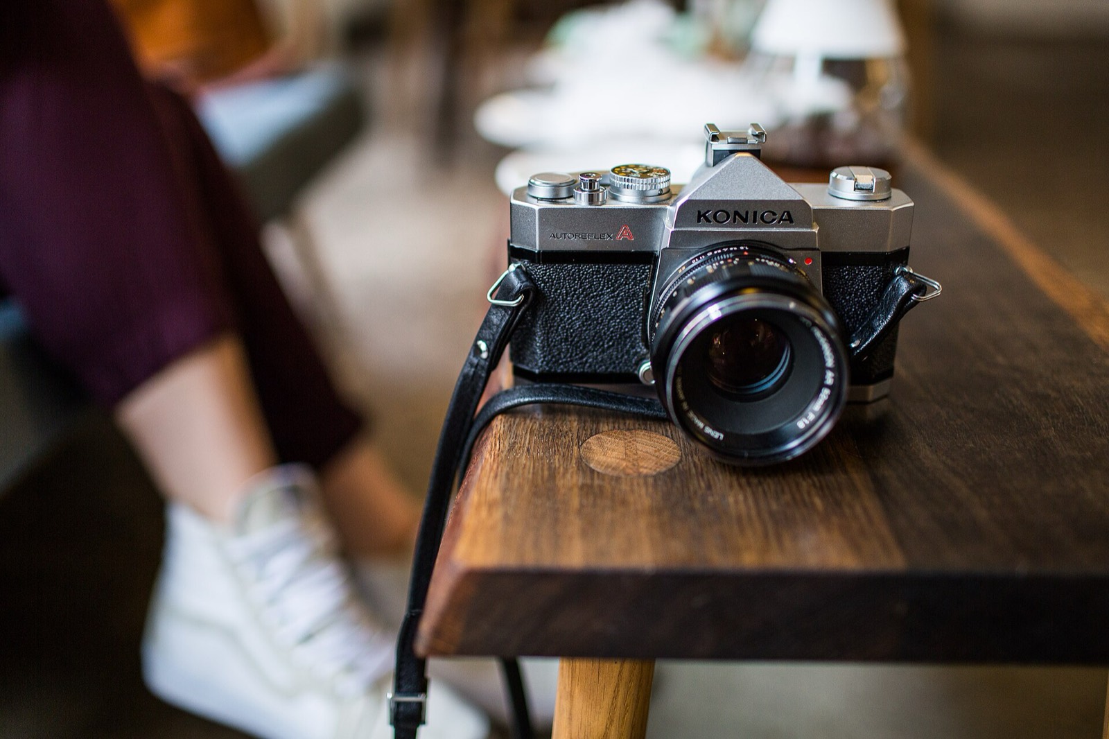 Film camera resting on a wooden table